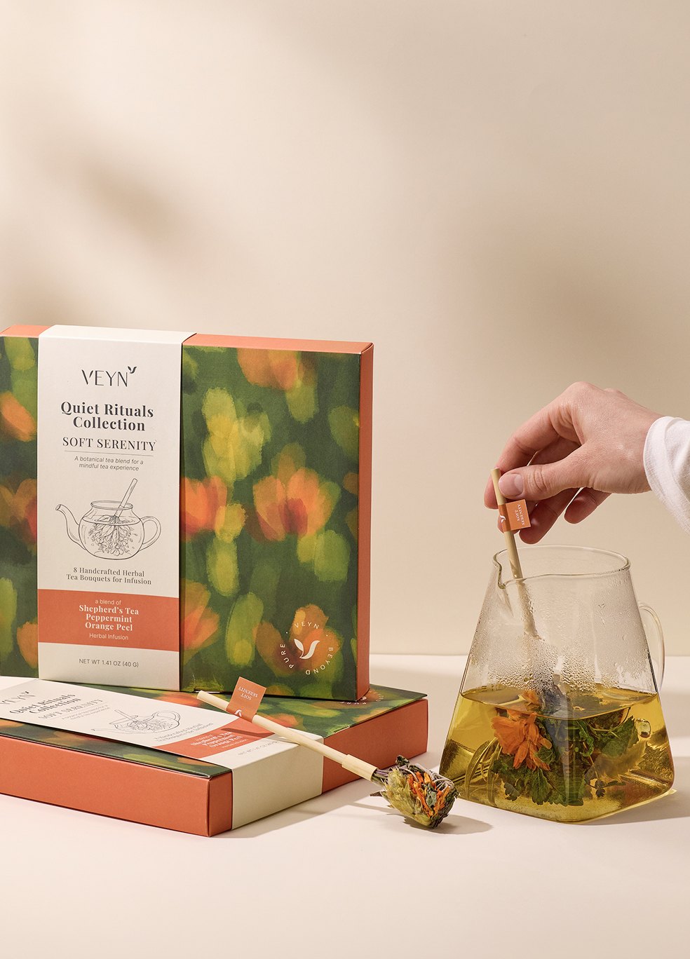 Soft Serenity Botanical Tea Bouquet blooming in a glass teapot.